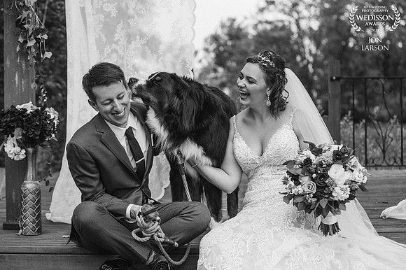 Megan and Dylan at the alter just before family formals with "Mans best friend" and a kiss