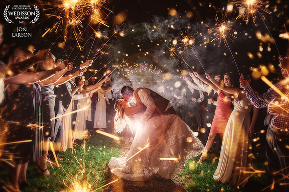 Marycate and Geoff In the middle of sparks during their sparkler exit